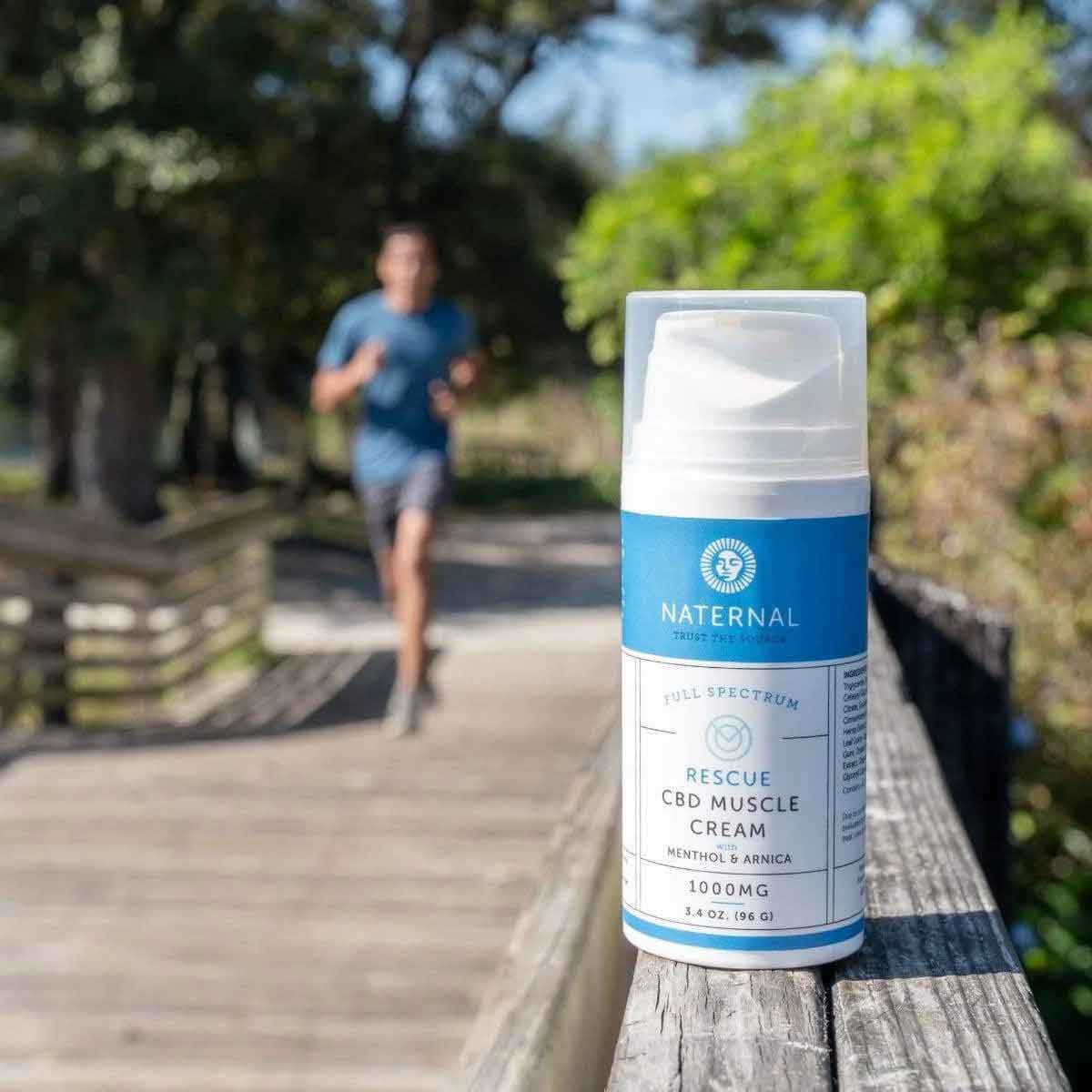 Rescue CBD Muscle Cream 2000mg displayed on a wooden surface