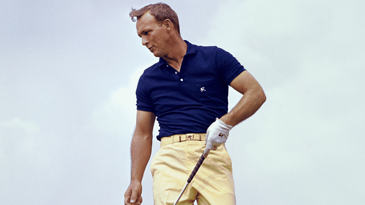 Iconic picture of Arnold Palmer on a tee box.