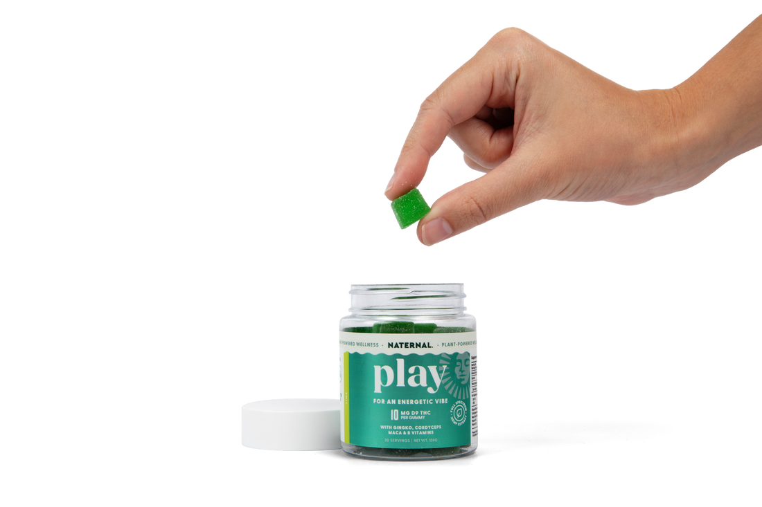 A Play gummy lifted from the jar